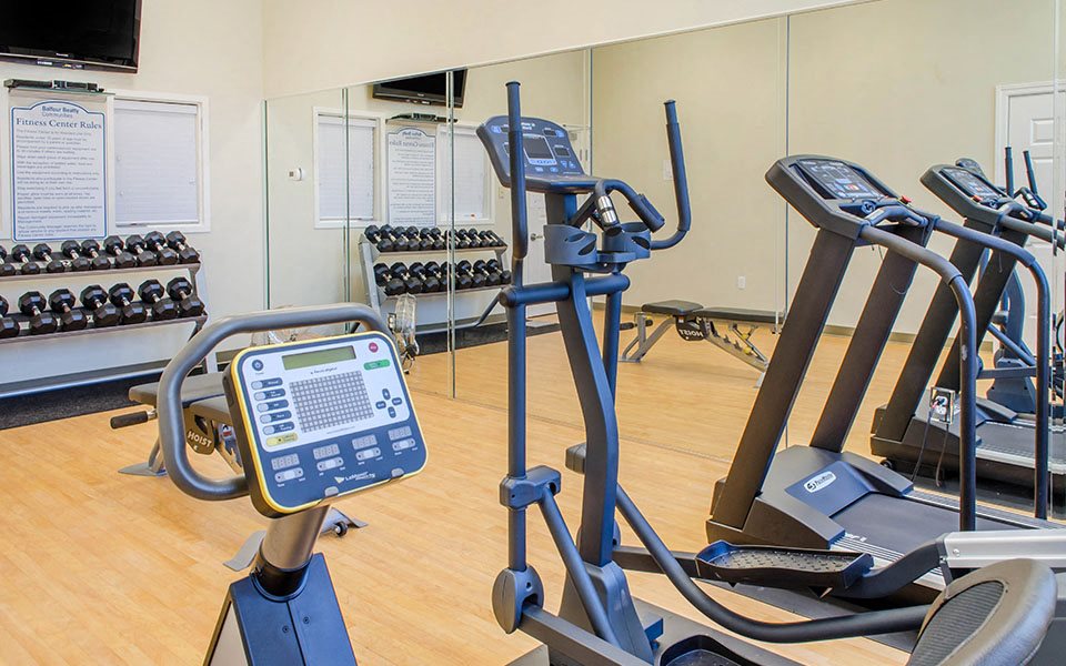 fitness center cardio equipment and weights
